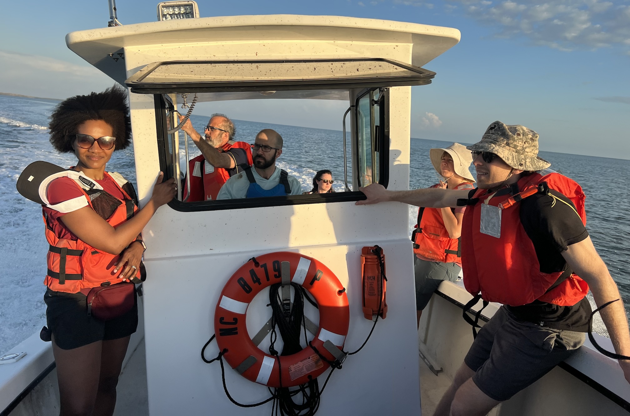 Lab members in a boat